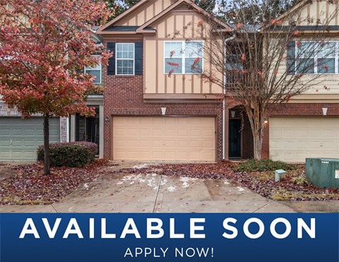 a suburban house with aiable soon sign in front of it